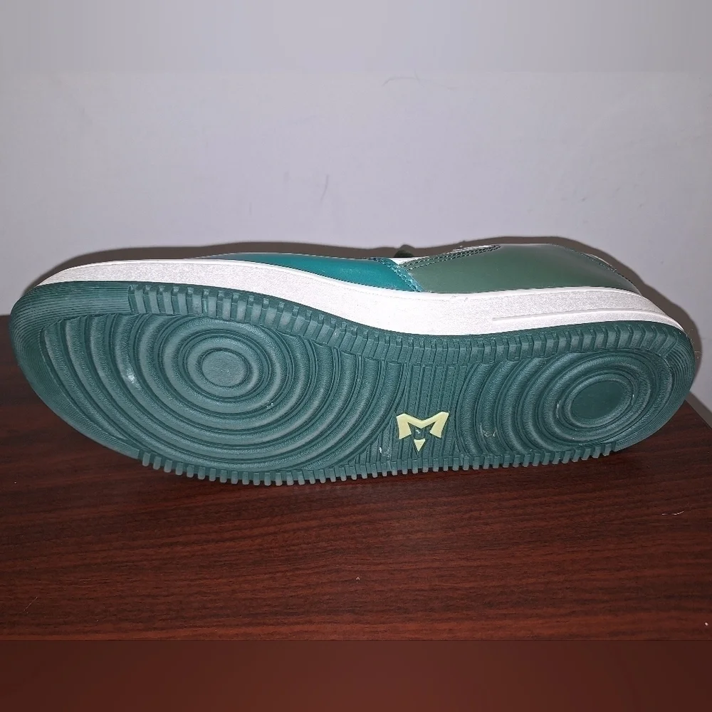 A pair of Starbury men's size 14 green sneakers. They're in excellent condition